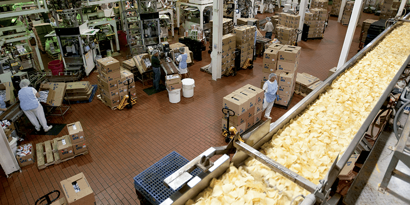 Employees preparing boxes of chips at Utz Potato Chip Factory