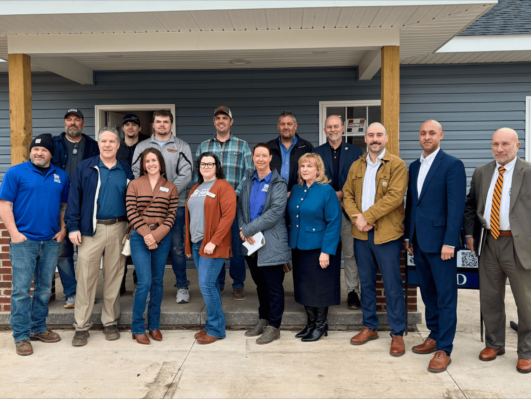 Group photo of project stakeholders and local officials touring Williamsport