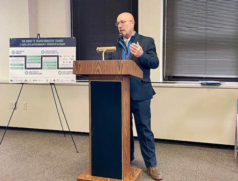 Deputy Secretary for Community Affairs and Development Rick Vilello speaking at a podium