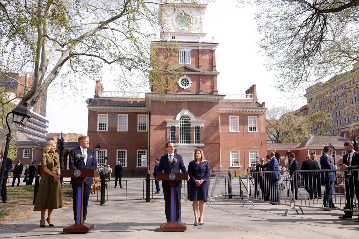 Governor Josh Shapiro and His Majesty King Willem-Alexander speaking at podiums in front of Liberty Hall