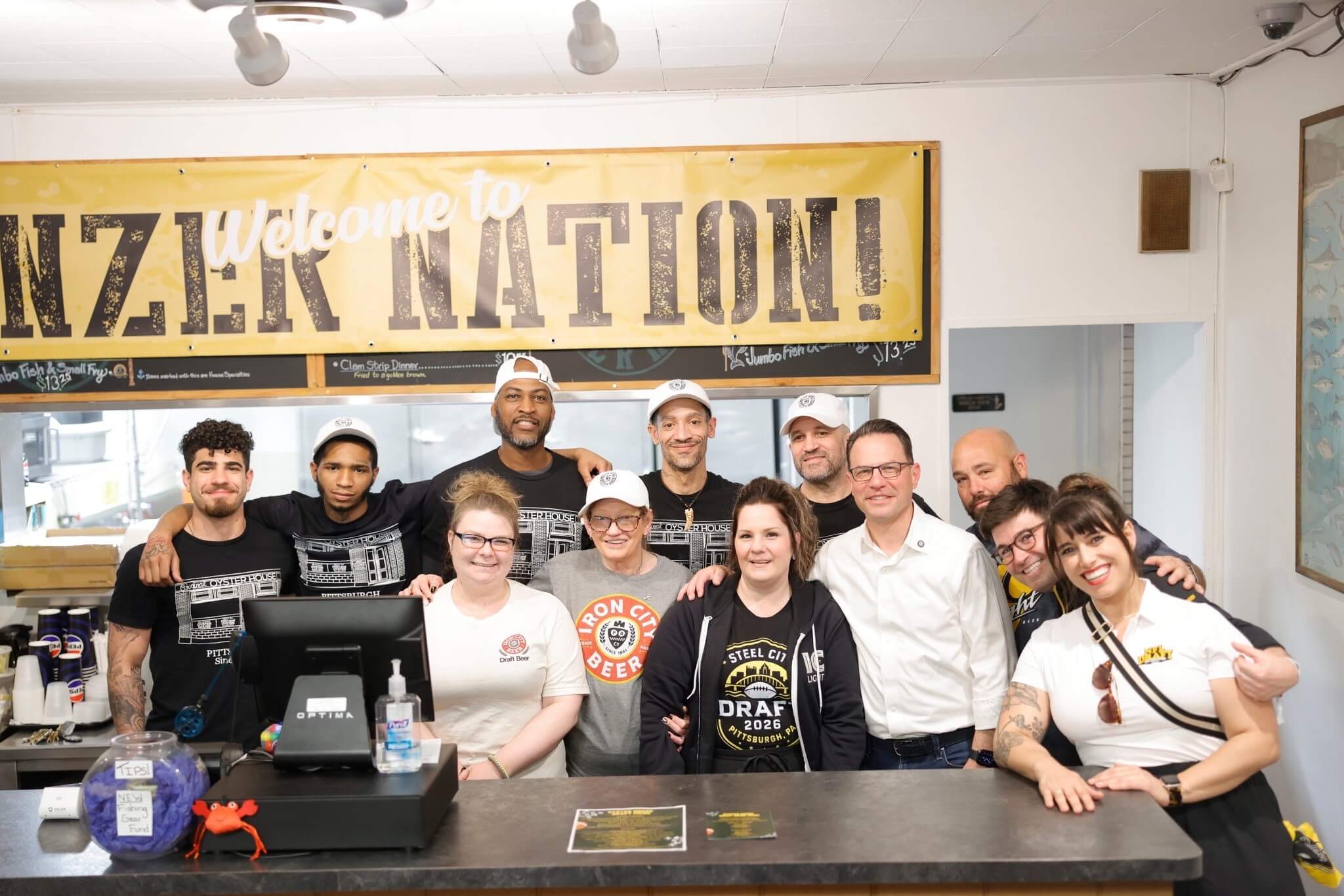 Group photo of Pennsylvania Governor Josh Shapiro with local business personnel in Downtown Pittsburgh